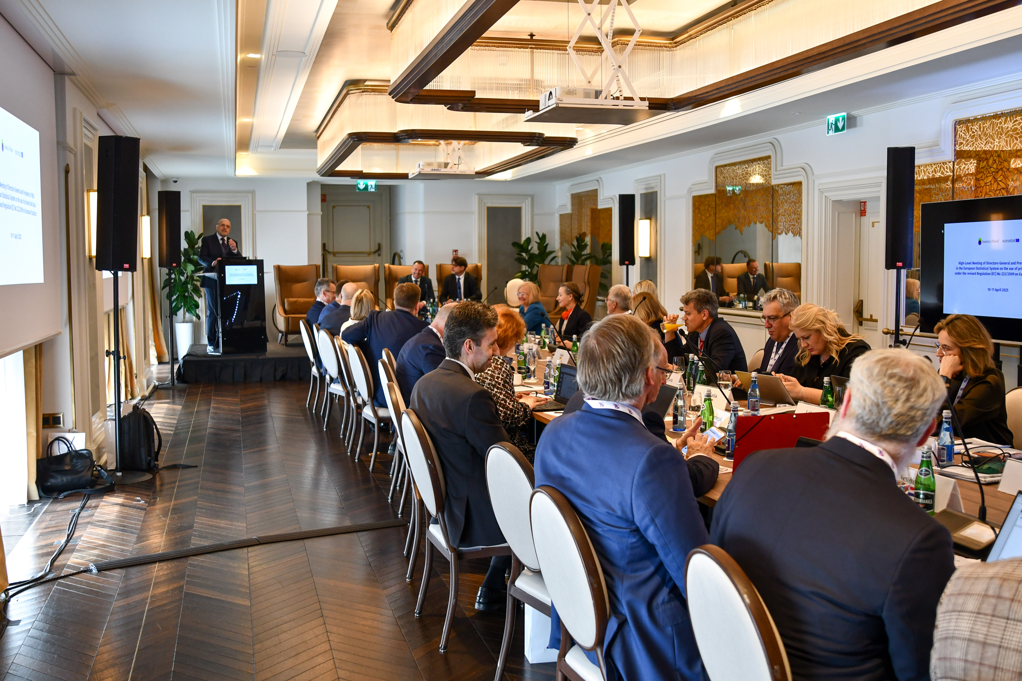 Zoom in  - Guests of the High-level meeting in the conference room. Speaker:  Marek Cierpiał-Wolan from Poland